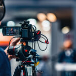 Cameraman recording at video deposition