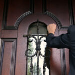 woman process server knocking on door to attempt serving documents