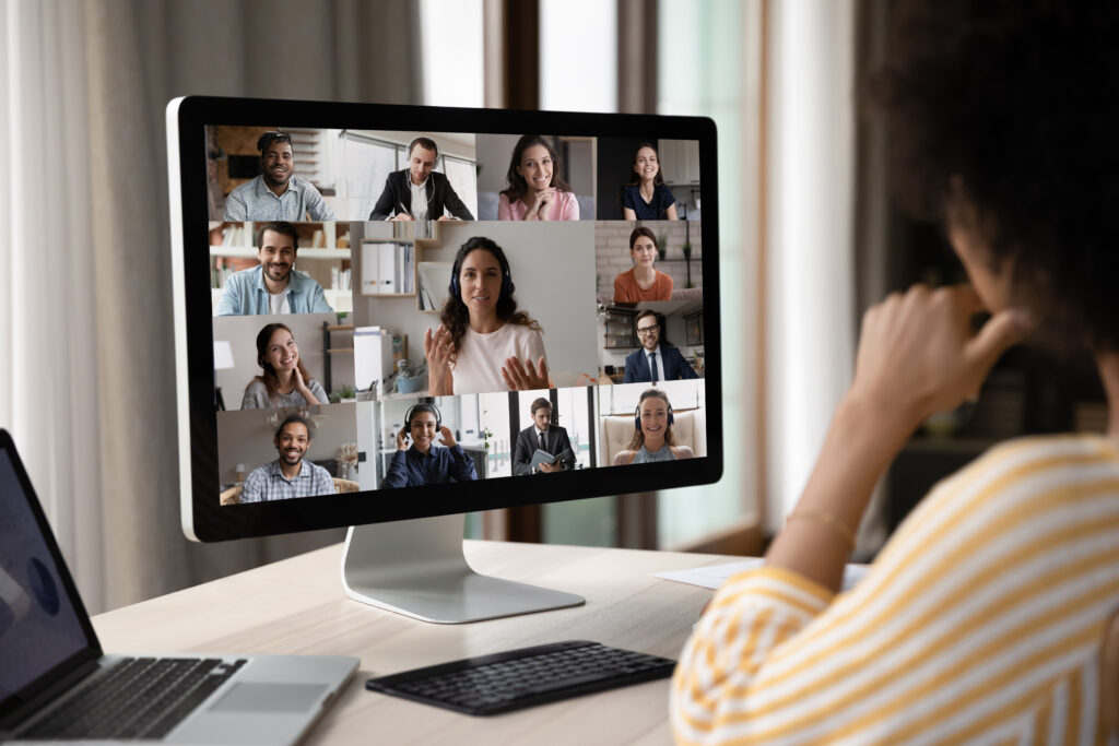 woman looking at a computer screen of a virtual meeting for a post-trial jury interview