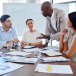 jury consultant talking with lawyers sitting around a conference table