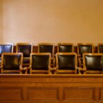 old fashioned jury box in a courtroom where jury research services will take place
