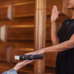 Bailiff giving oath to witness during deposition vs testimony